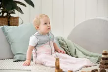 Toddler in Sleep Bag playing